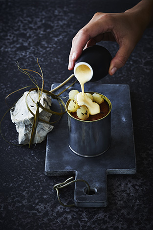 Hangi Steamed Pudding, Roasted Corn Anglaise, Horopito Spiced Apples. Hiakai Winter Menu by Monique Fiso. Recipe and food styling by Monique Fiso. Styling and photography by Manja Wachsmuth. Plate and butter dish from The Propsdepartment. Background from